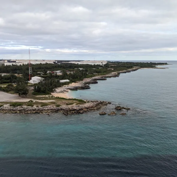 Shoreline stretching away from port