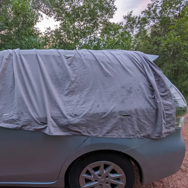 Car with a blanket over it.